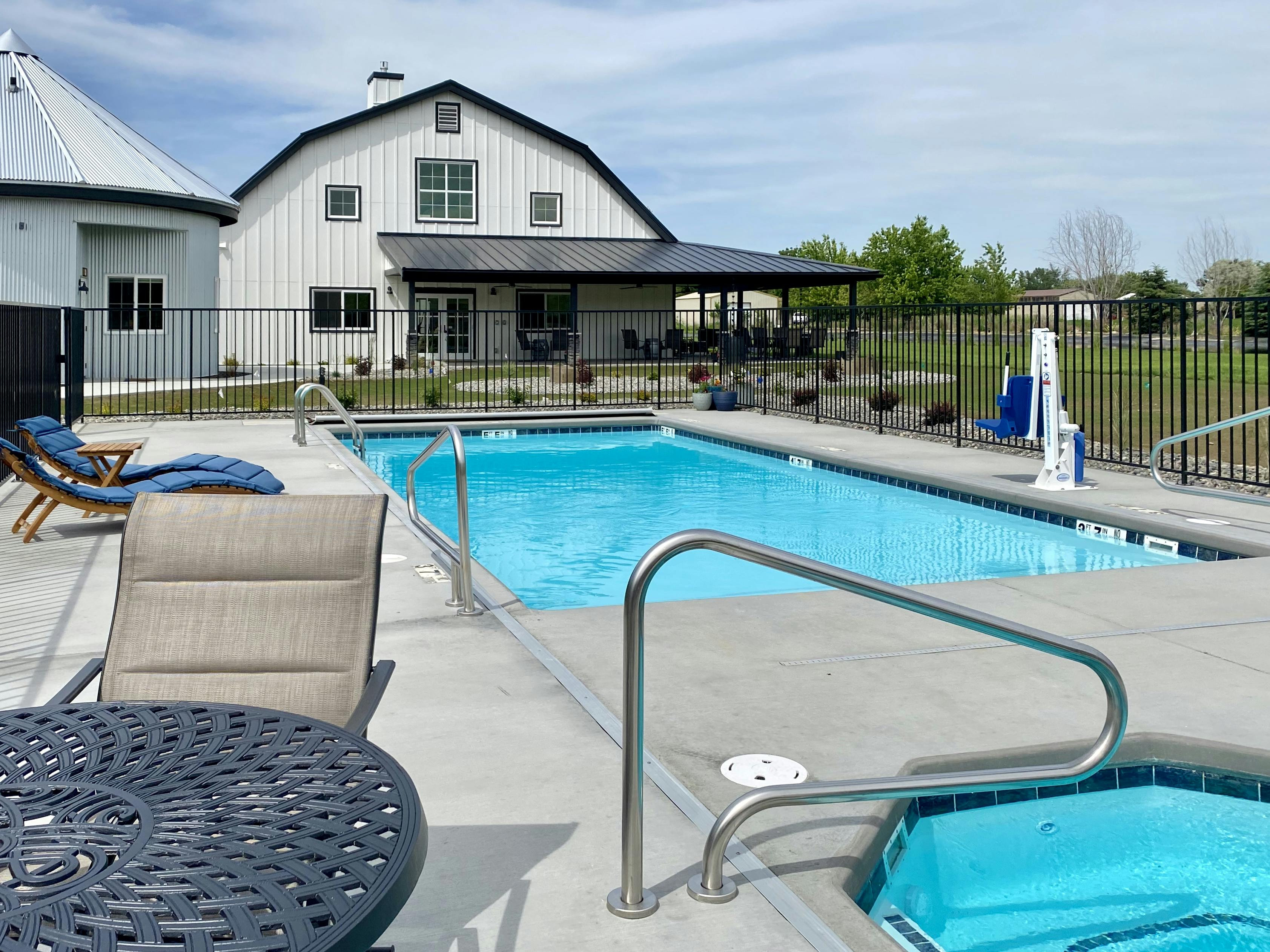 Heated outdoor pool and hot tub just steps from your suite